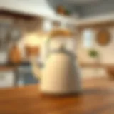 Elegant cream colored tea kettle on a wooden kitchen counter